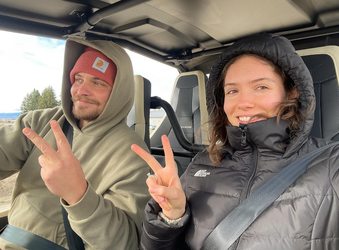 Luke Grimes and his wife Bianca Rodrigues driving through Montana in a post to Instagram.